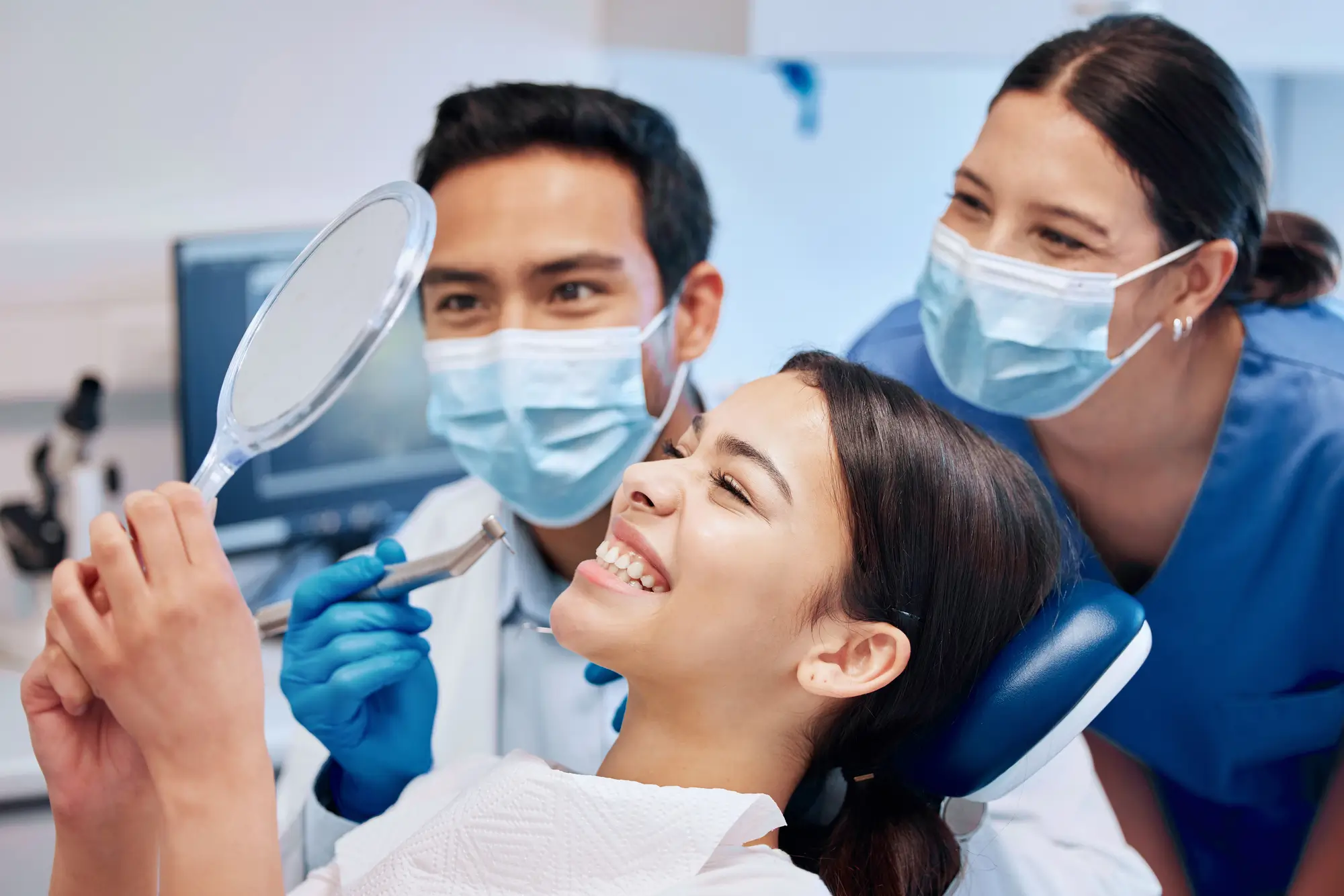 Young woman excited with new smile at family dentist near Arlington VA