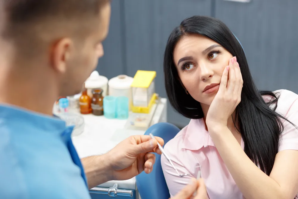 dentist addressing dental pain